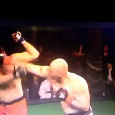 Coach Derek Roth demonstrating a solid cross punch form in the ring