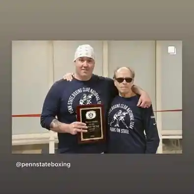 Coach Derek Roth and Coach Mark with Coach of the Year award