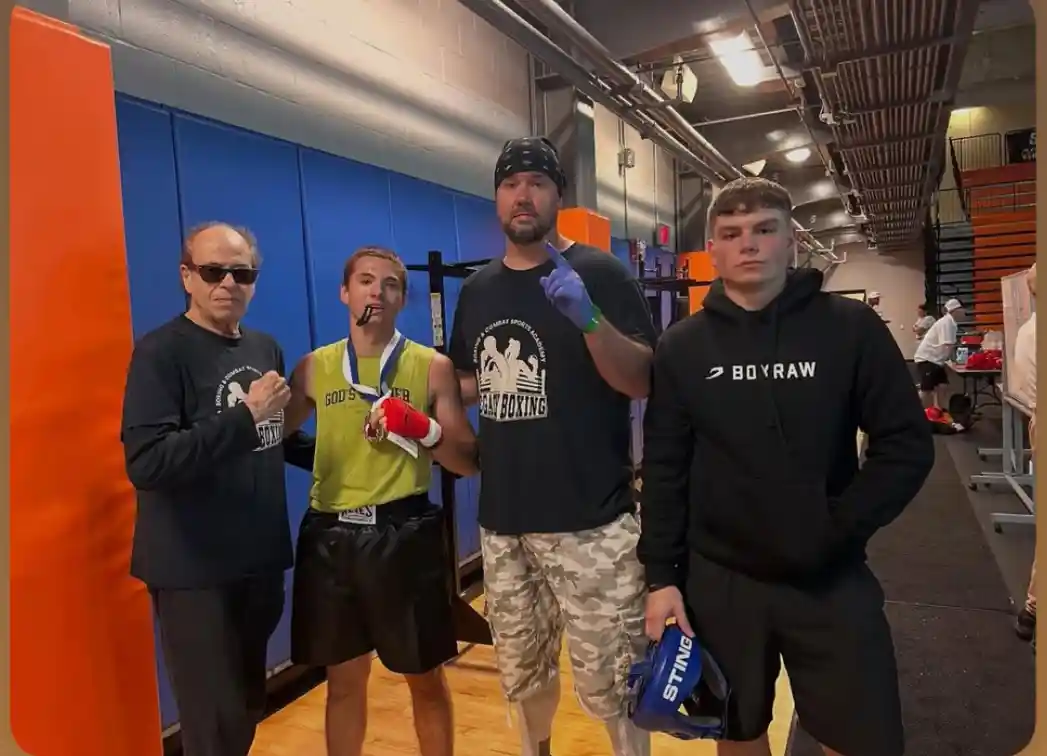 Coach Derek Roth with one of our kid boxers after winning a competition