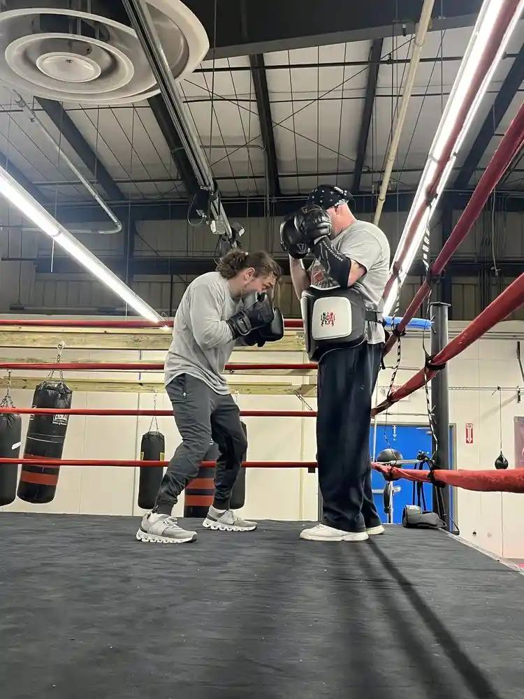 Private boxing training session with expert mitt and body pad instruction